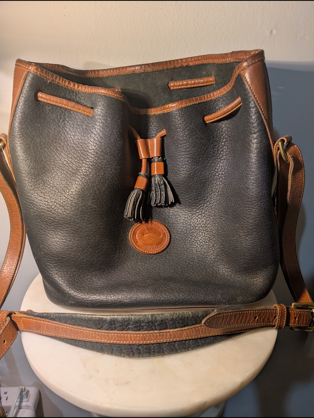 Dooney & Bourke Black Pebbled Leather Drawstring Tote with Brown Trim